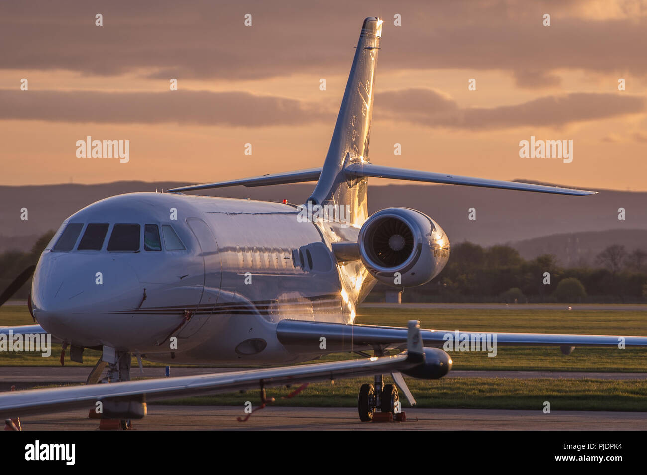 A Dassault Falcon business jet seen on the ramp at Glasgow International Airport, Renfrewshire, Scotland. Stock Photo