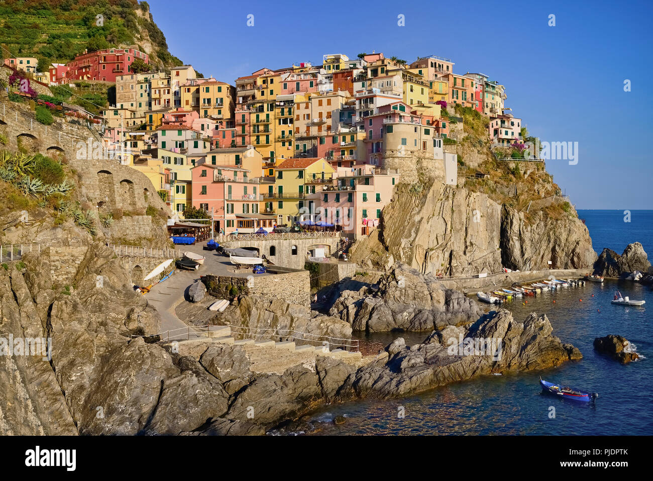 Italy, Liguria, Cinque Terre, Manarola, General vista of the town from Punta Bonfiglio opposite. Stock Photo