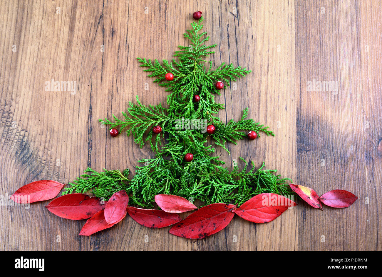 Christmas Tree Made Of Pine Twigs And Blueberry Leaves At Wooden Background Stock Photo Alamy