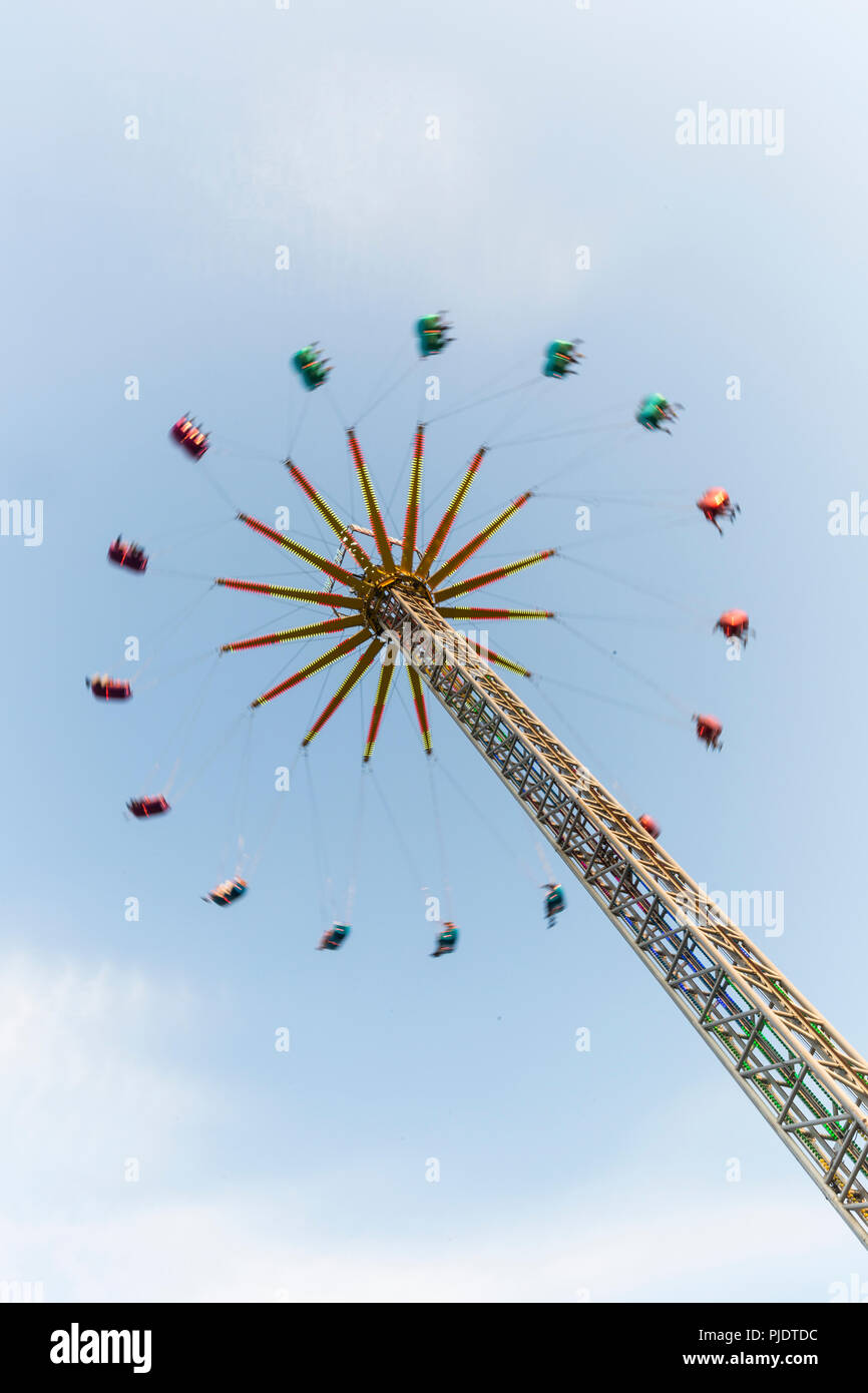 Carnival ride spinning at high speed. Stock Photo