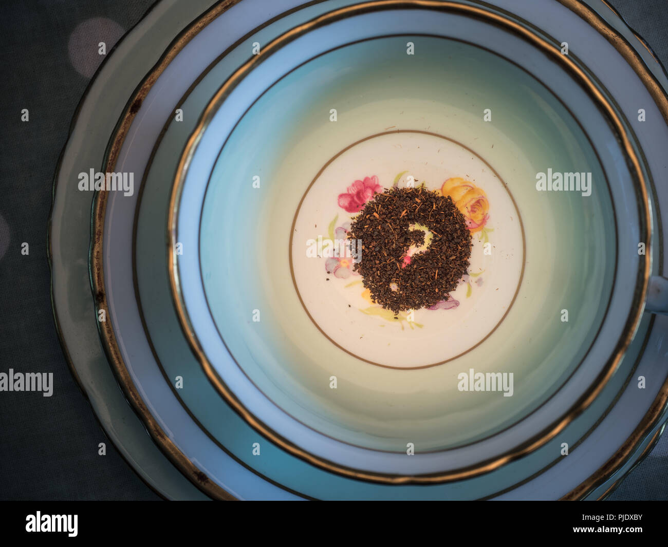 Reading the tea leaves, cup and saucer Stock Photo Alamy