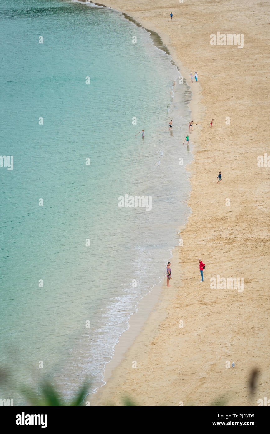 St. Ives, England -  June 2018 : People walking on the long and beautiful Porthminster  Beach, Cornwall, UK Stock Photo