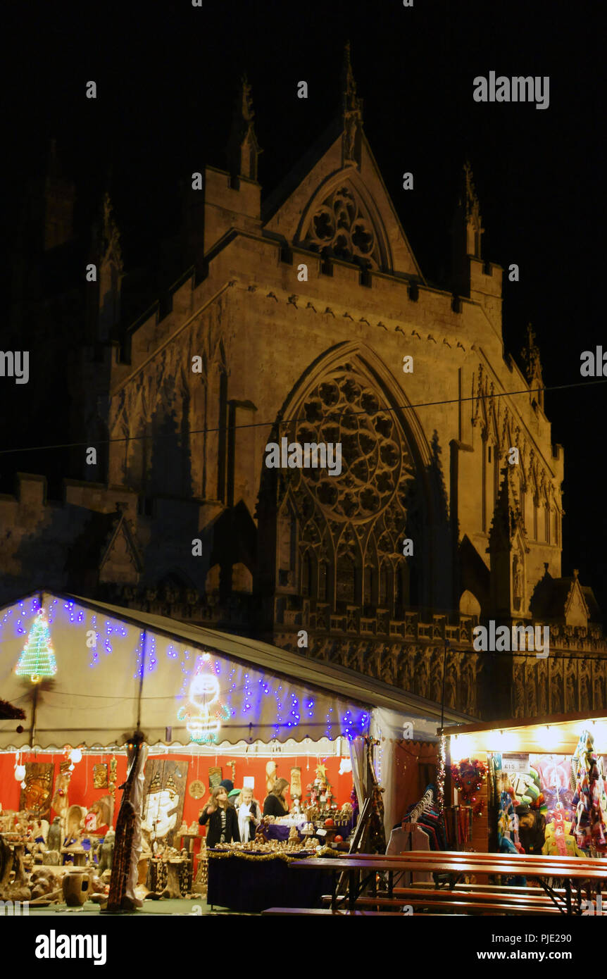 Exeter Devon. Cathedral grounds are hosting the Christmas fair, stall from Europe are open until late. Stock Photo