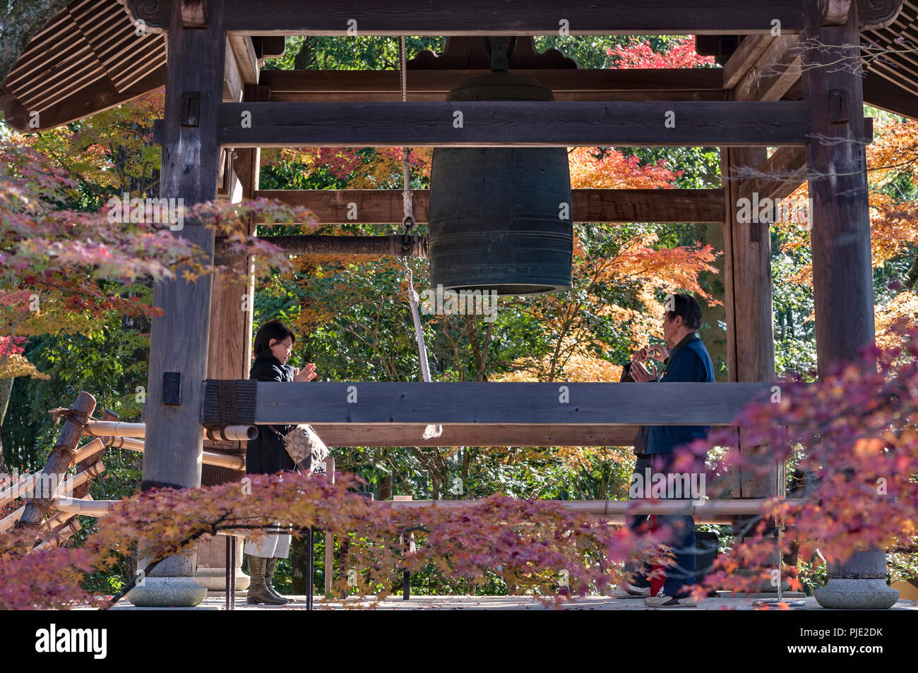 Kyoto, Japan. Worshippers pray at Kinkakuji Temple (the Golden