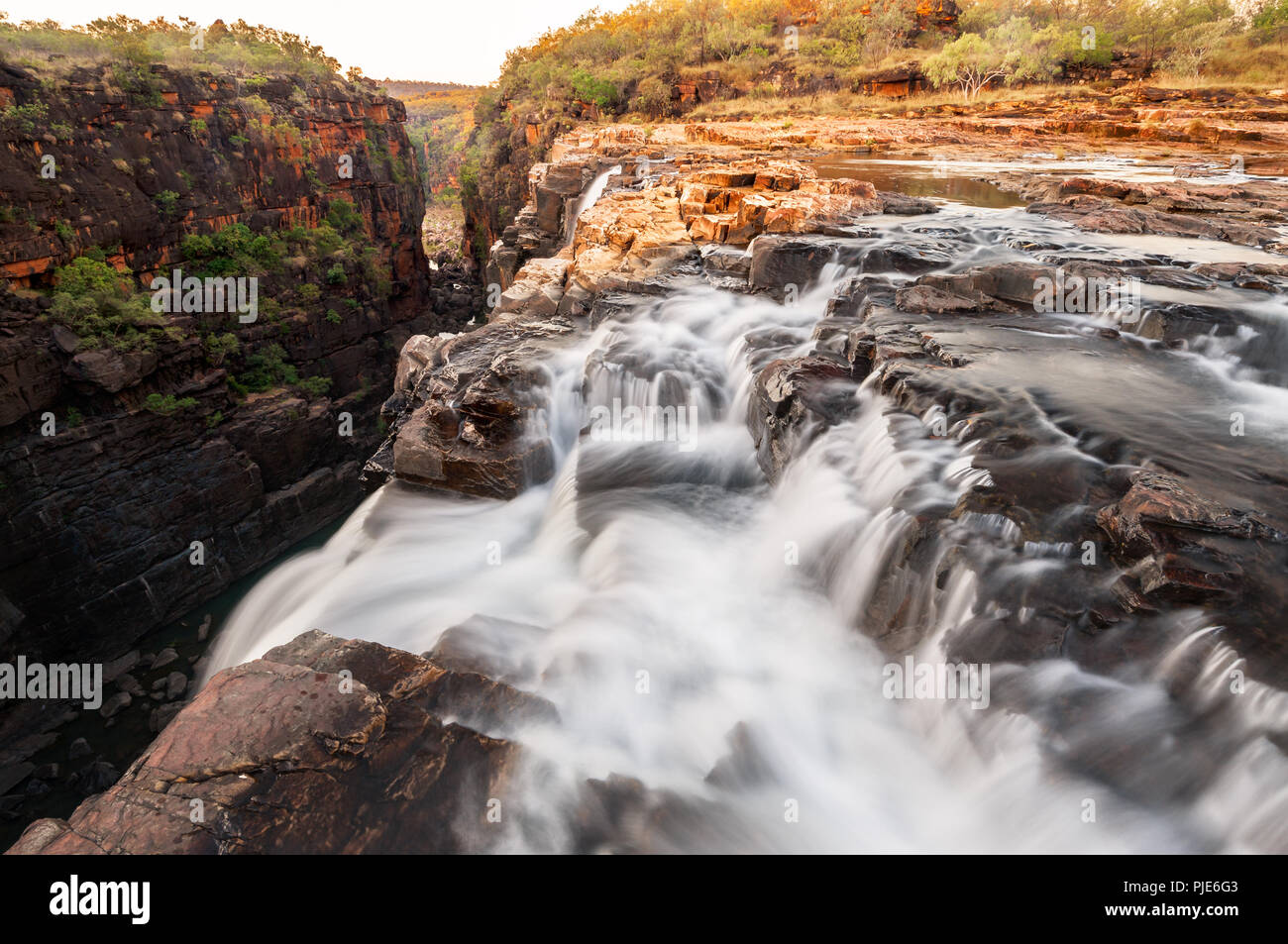 Mertens Falls going right over the edge in the Wilderness of the Kimberley. Stock Photo