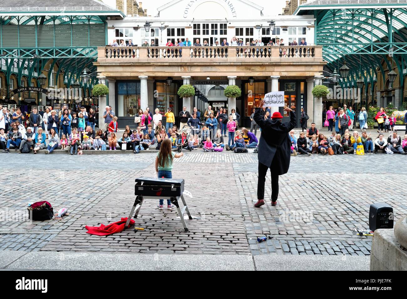 Entertainer working the crowds in Covent Garden Central London England UK Stock Photo