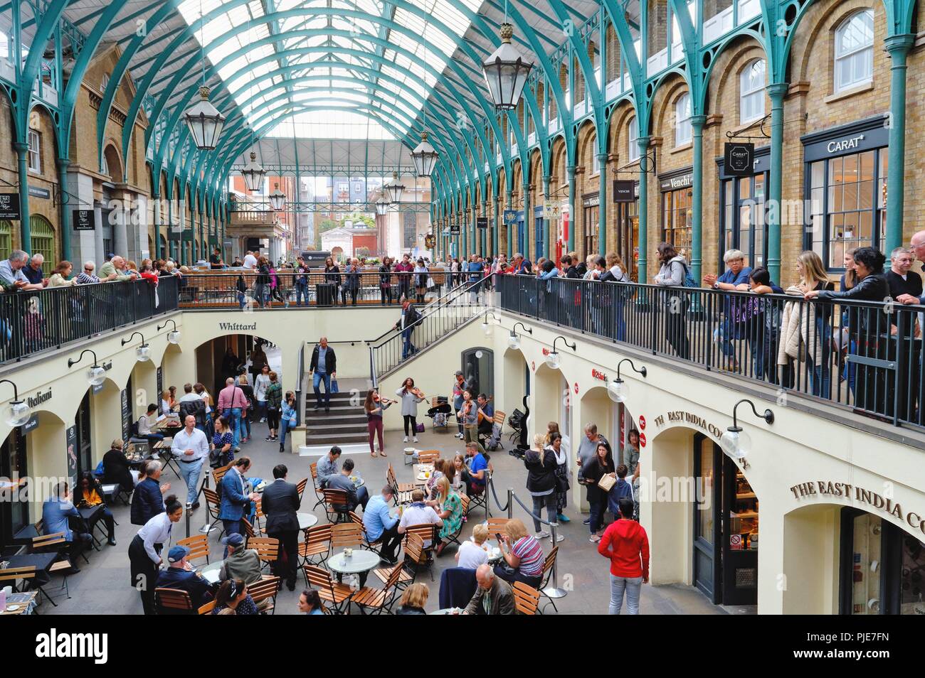 A crowded Covent Garden covered market Central London England UK Stock Photo