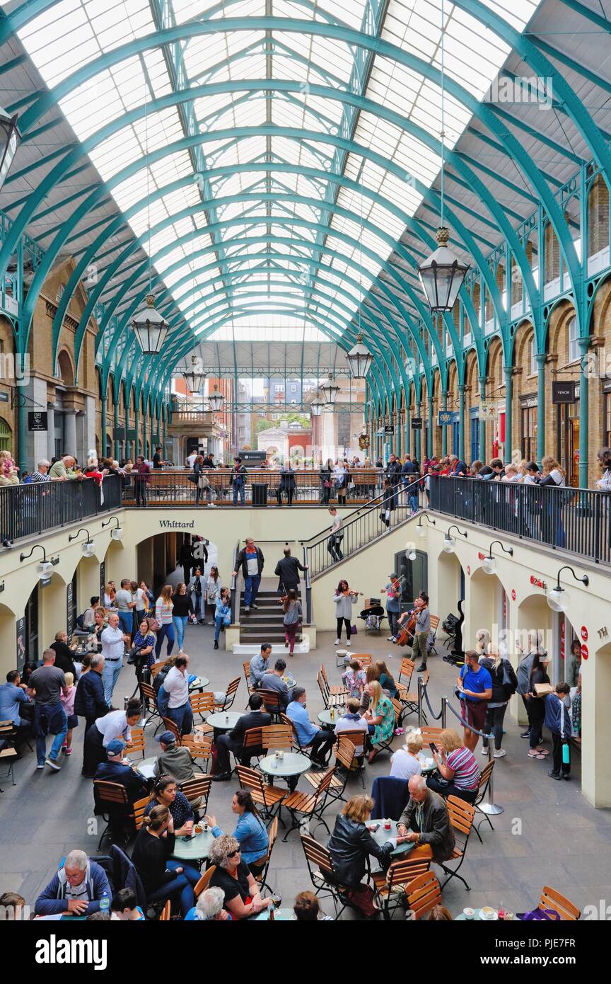 A crowded Covent Garden covered market Central London England UK Stock Photo