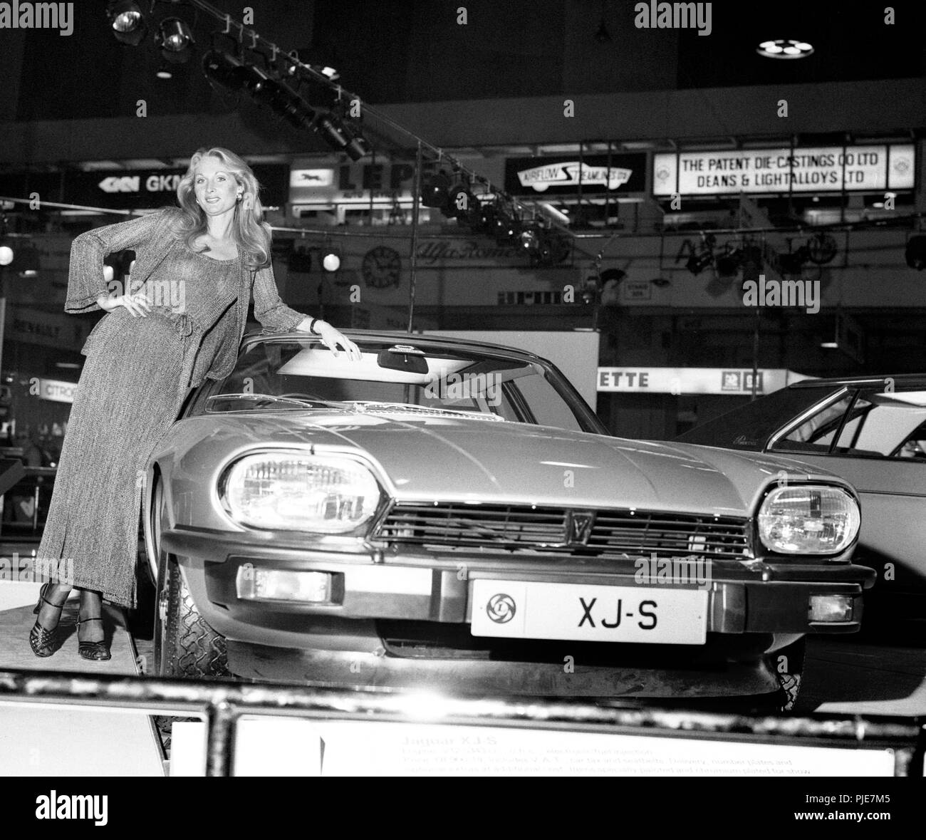 London model Susie Firmin adds her graceful lines to those of the new Jaguar XJ-S during a Press preview day at Earl's Court of the diamond jubilee Motor Show. Stock Photo