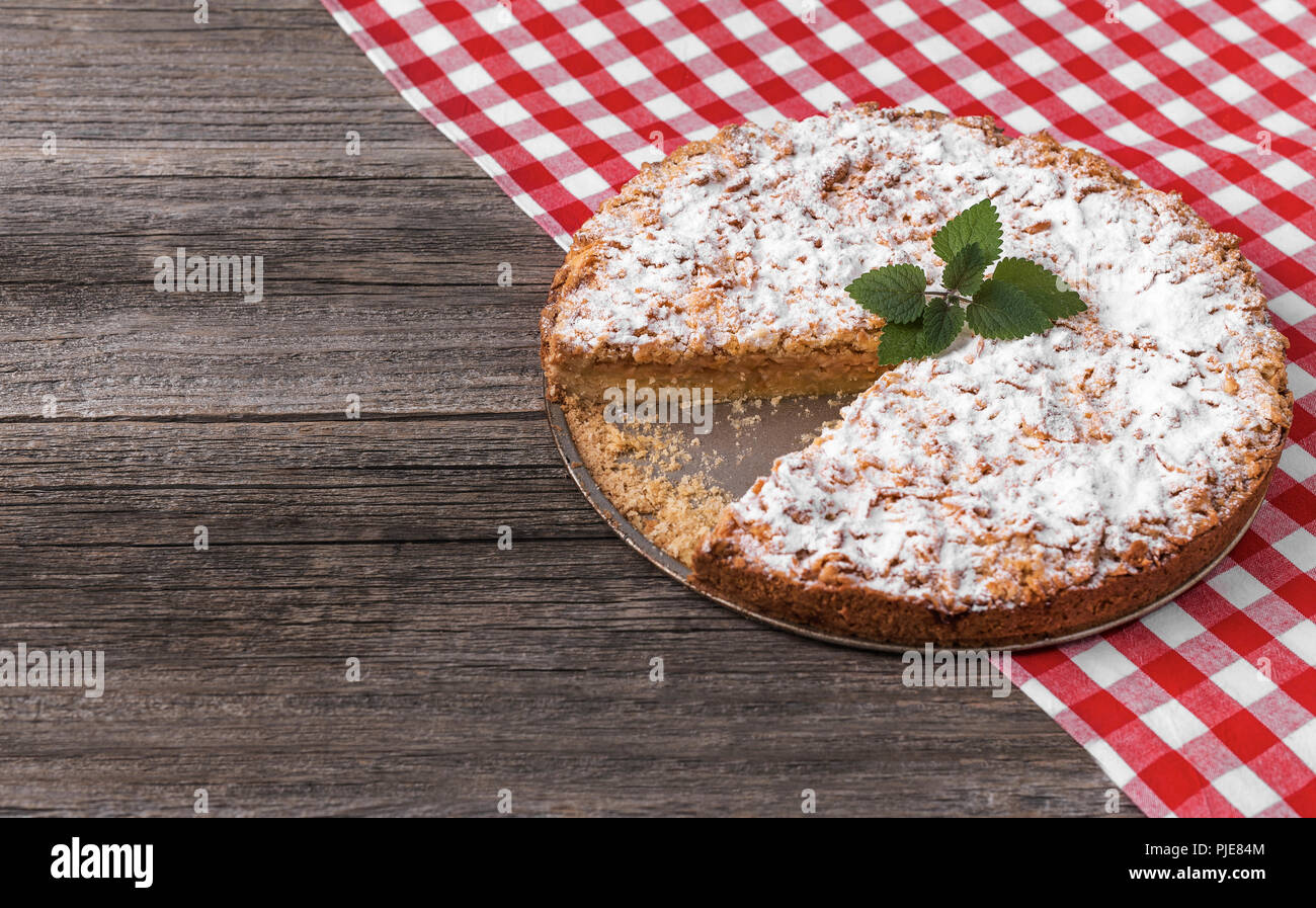 Apple pie on a wooden table. Close-up. Stock Photo