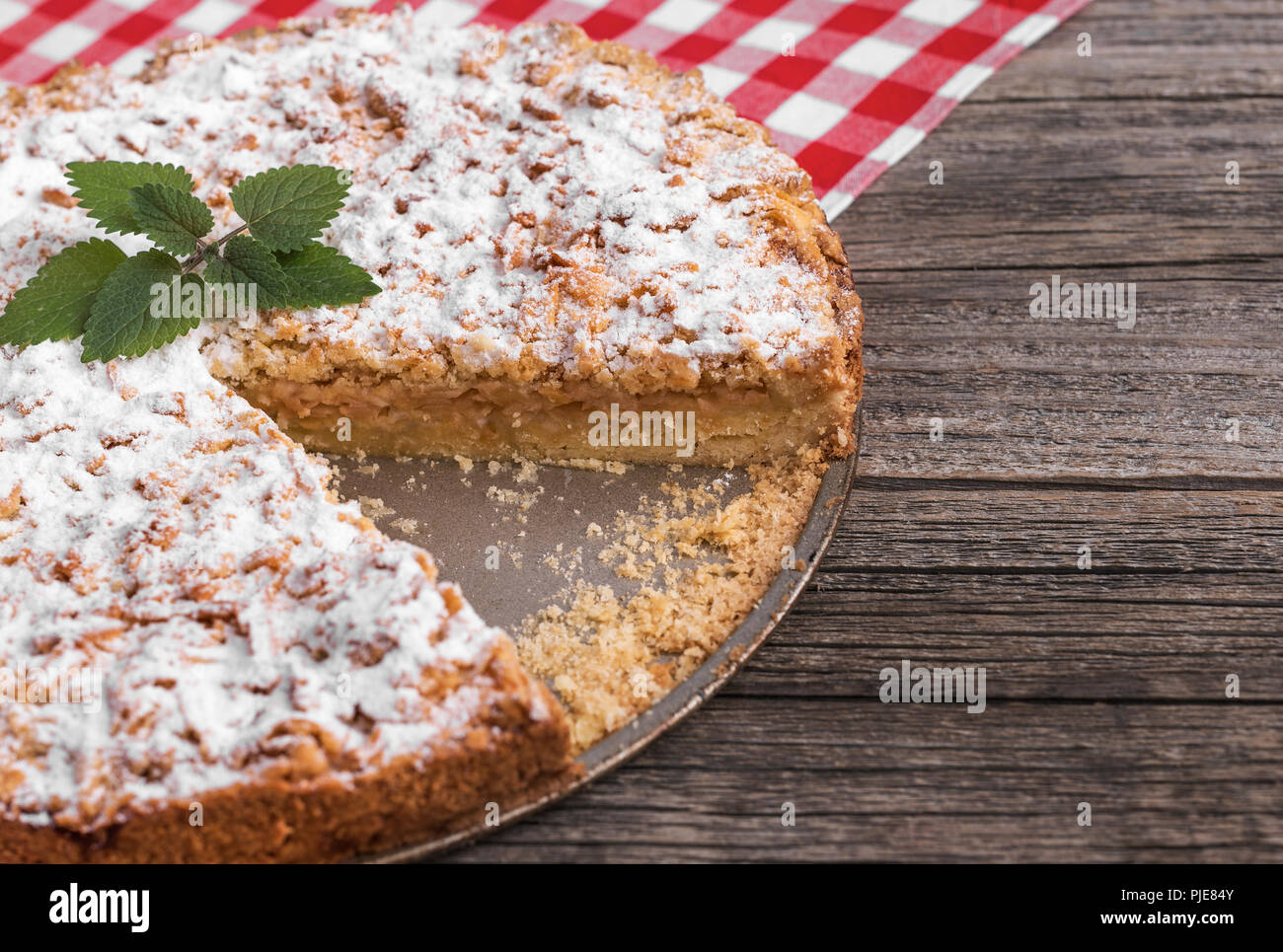 Apple pie on a wooden table. Close-up. Stock Photo