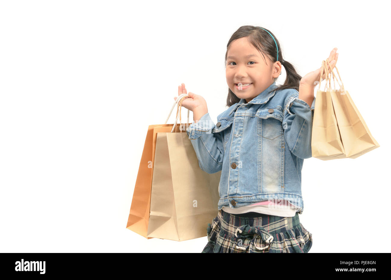 portrait of a surprised shopping girl holding shopping paper bags ...