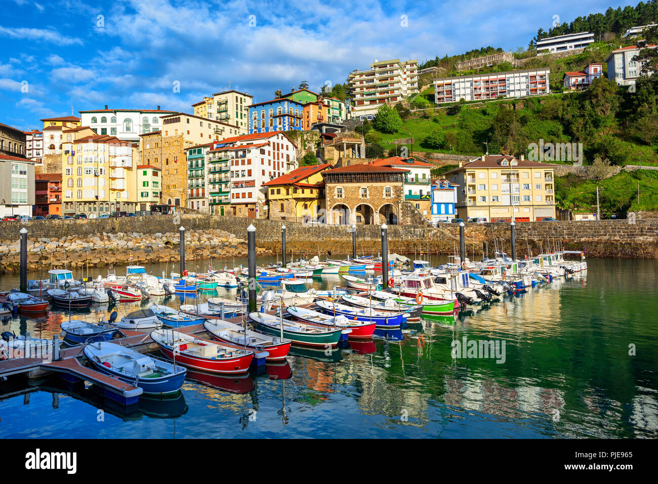 Colorful houses and fishing boats in Mutriku old town port, Basque country,  Spain Stock Photo - Alamy