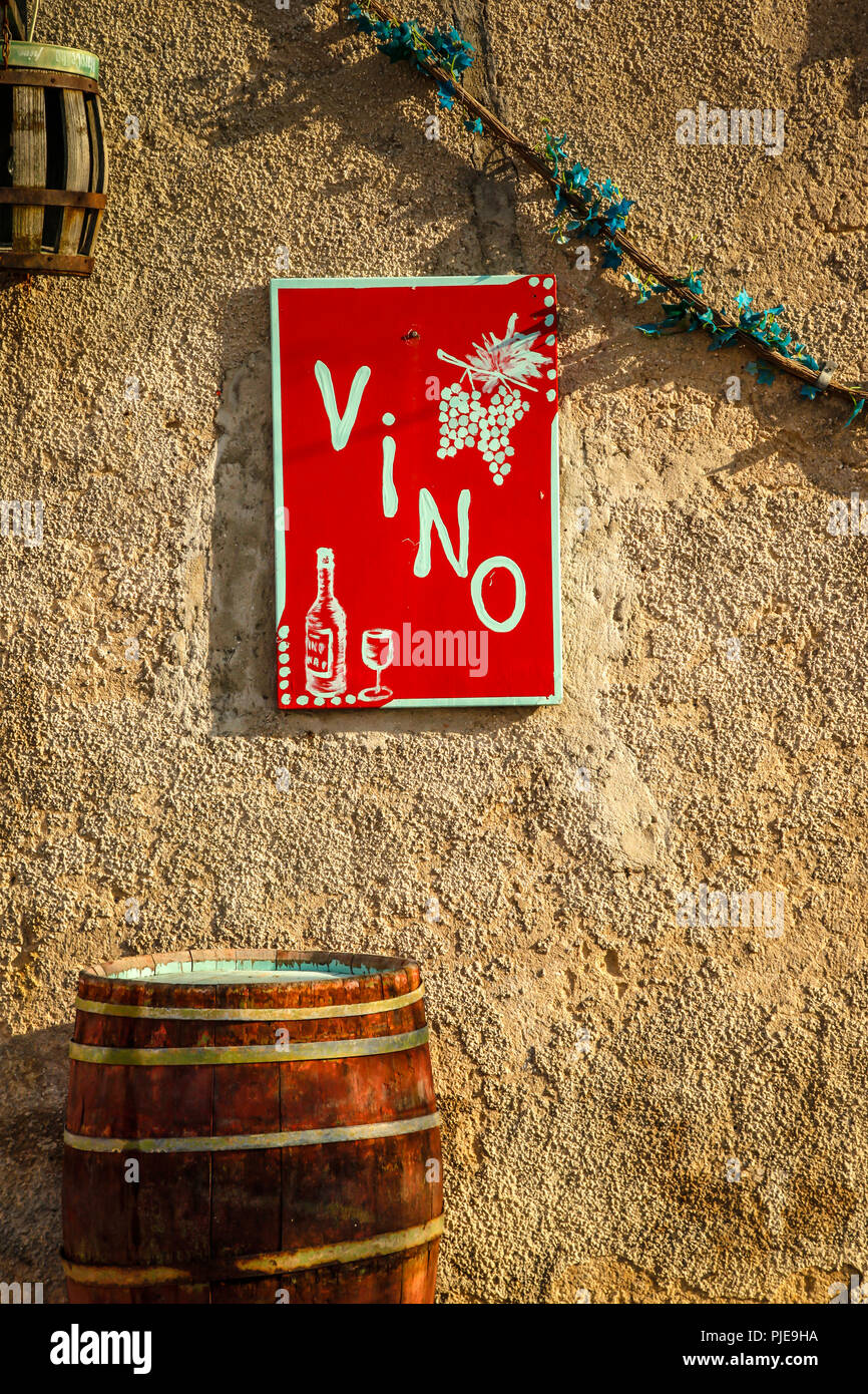 Red and white Vino (wine) store sign on the wall in the village of Baska on the Croatian island of Krk Stock Photo