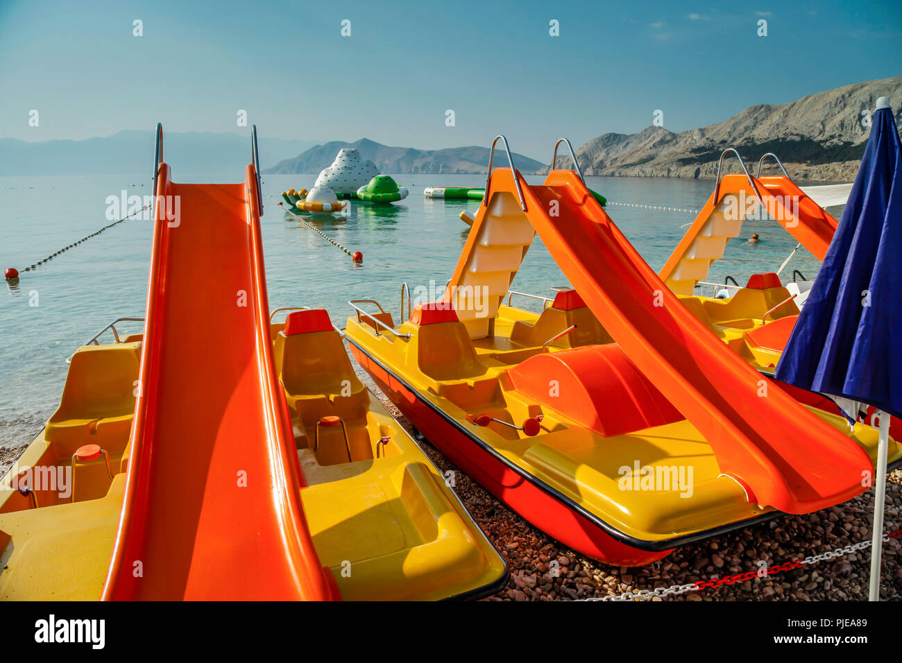 Beach slides and water sport toys at Baska resort on the Croatian island of Krk in the Adriatic Stock Photo