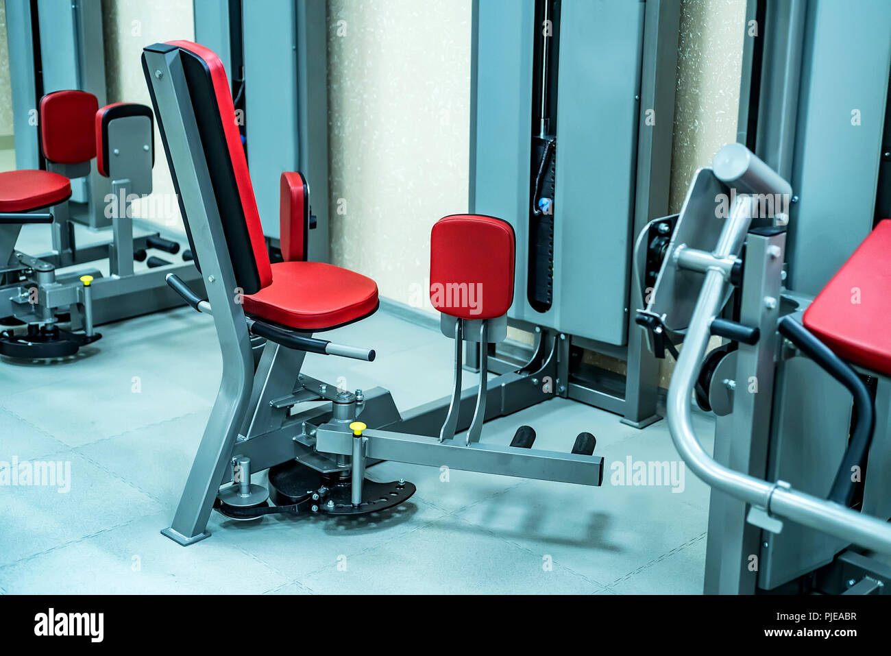 New fitness machines in modern gym interior Stock Photo