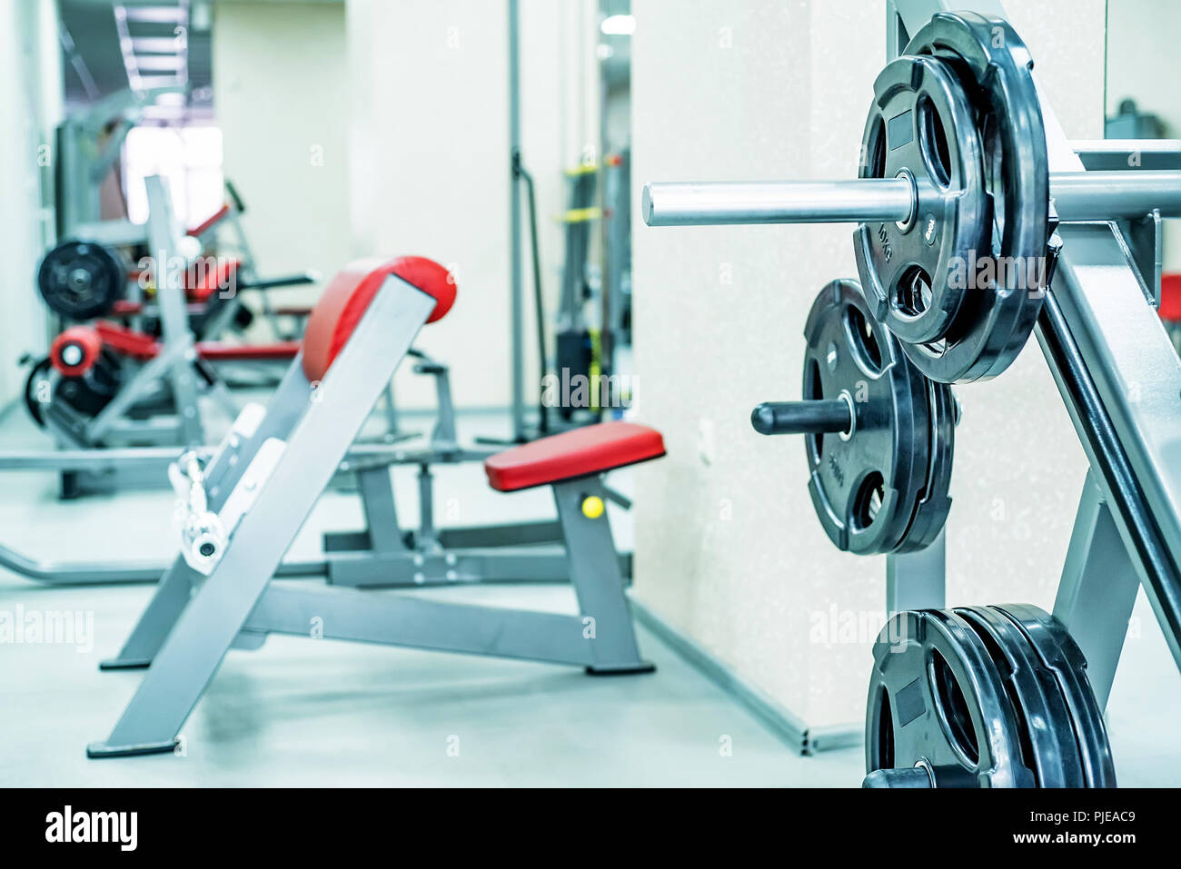 New fitness machines in modern gym interior Stock Photo