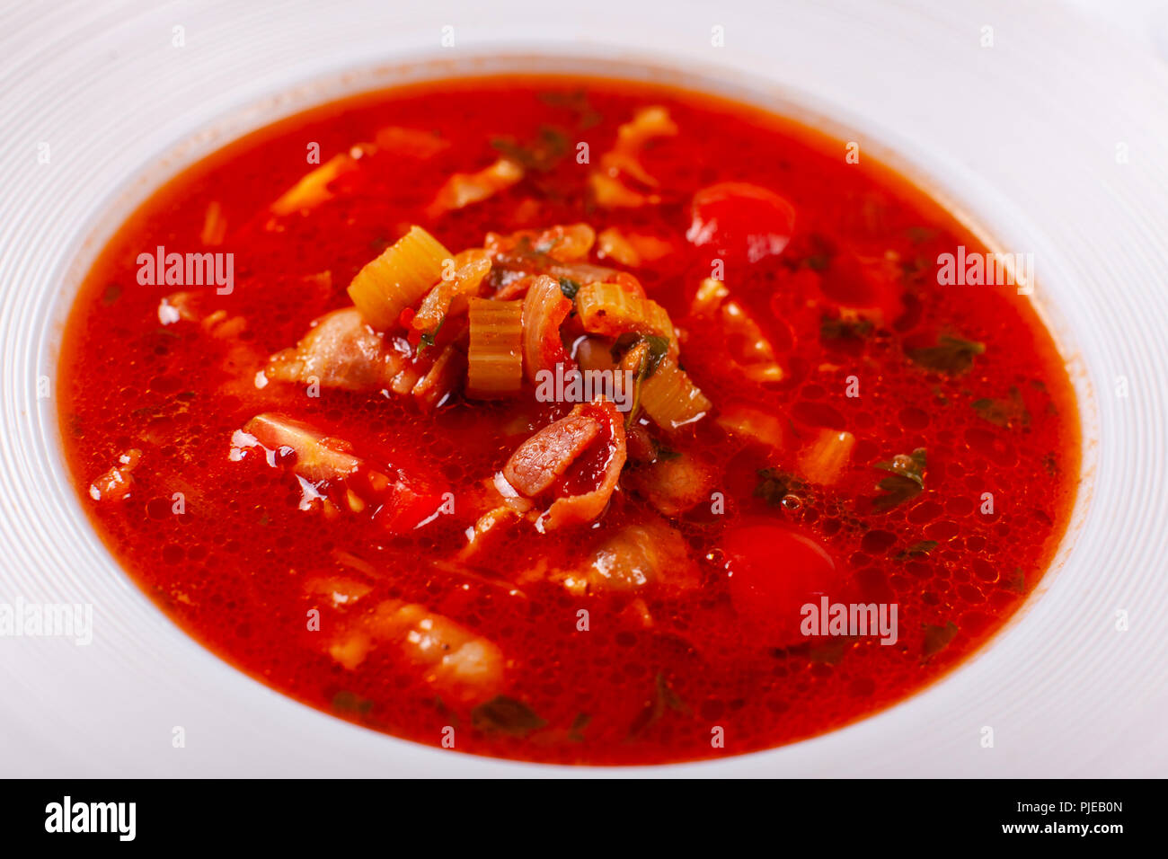 Fresh Mexican tomato soup with corn and vegetables. bowl of bean soup