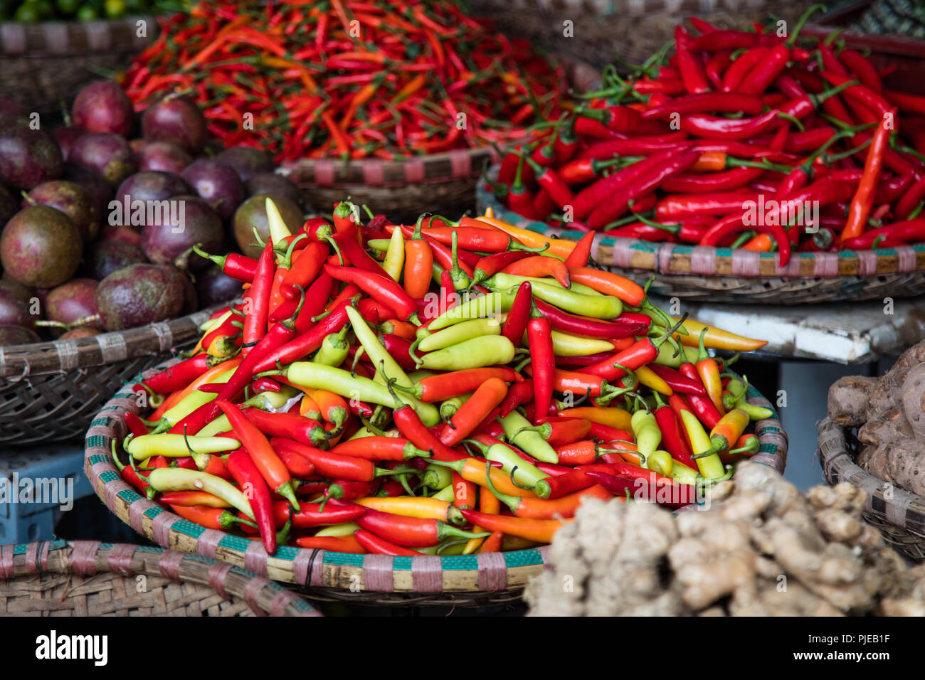 Baskets of fresh chili peppers at the market in Hanoi, Vietnam Stock Photo