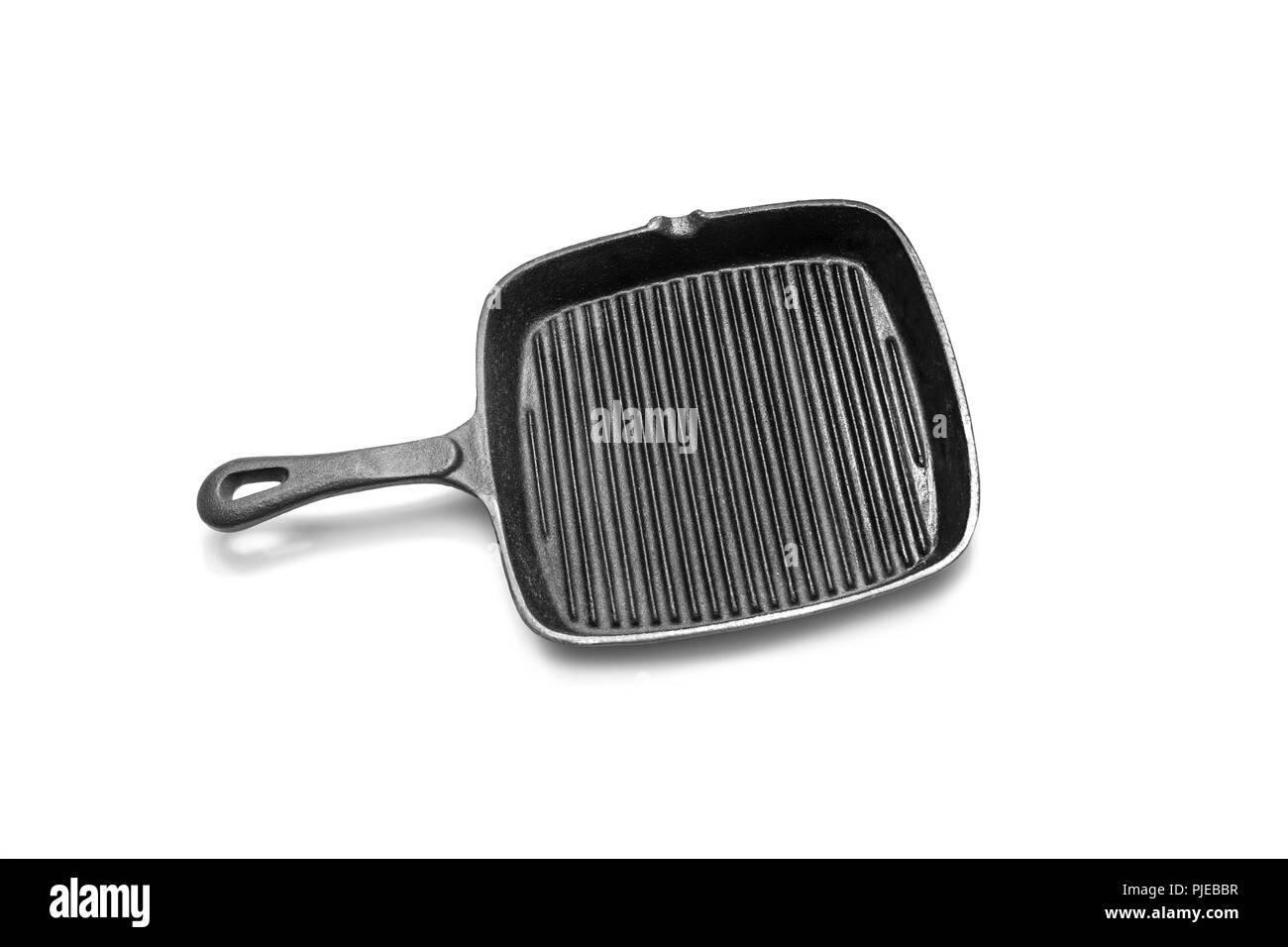 Cast empty grill pan. Isolated on white background Stock Photo Alamy