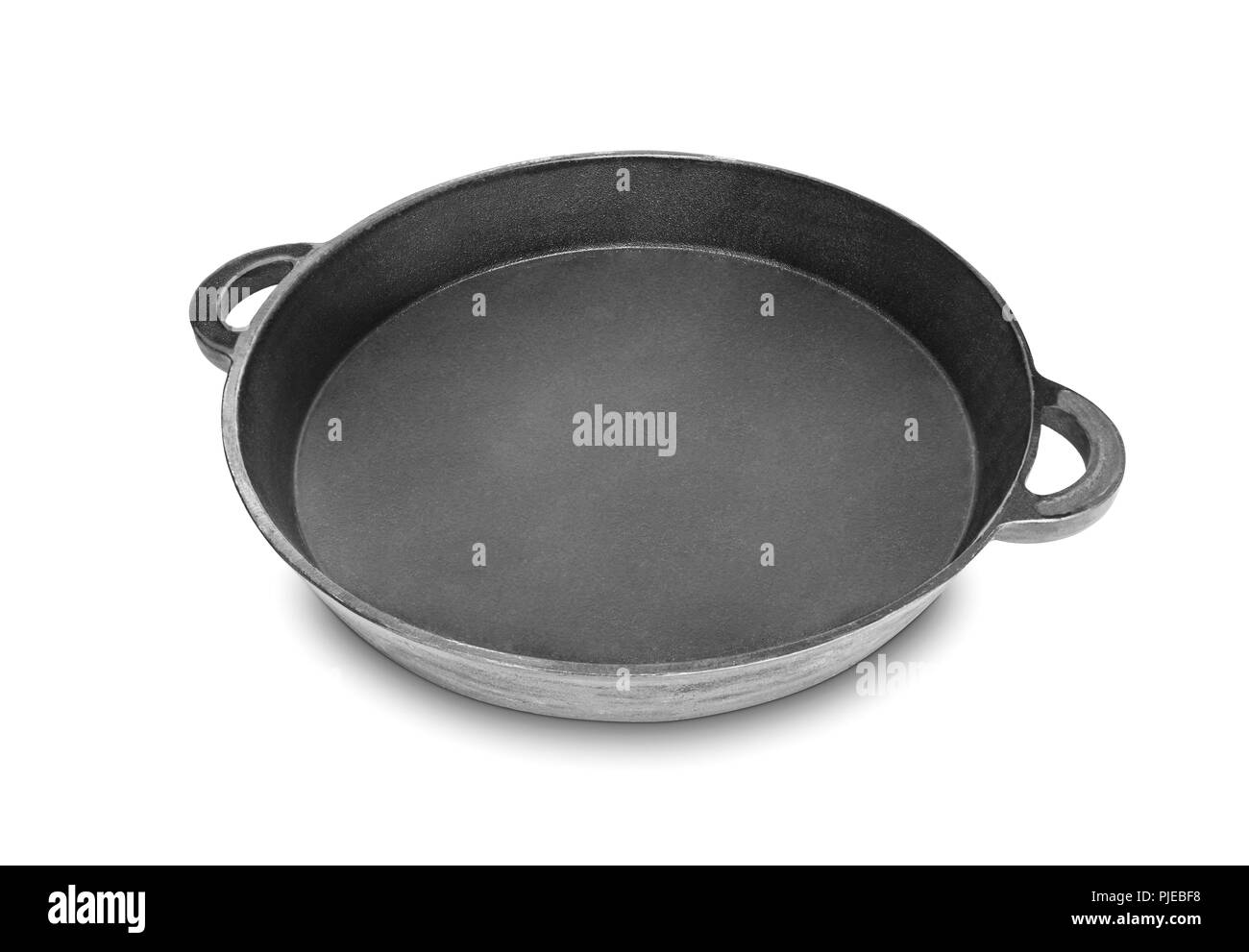 cast iron pan for paella isolated on white background Stock Photo