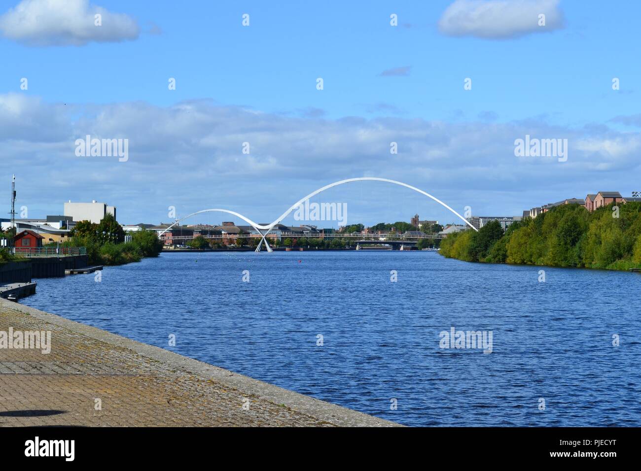 Striking, naturally lit image of the iconic Infinity Bridge spanning the River Tees in Stockton-on-Tees, UK Stock Photo