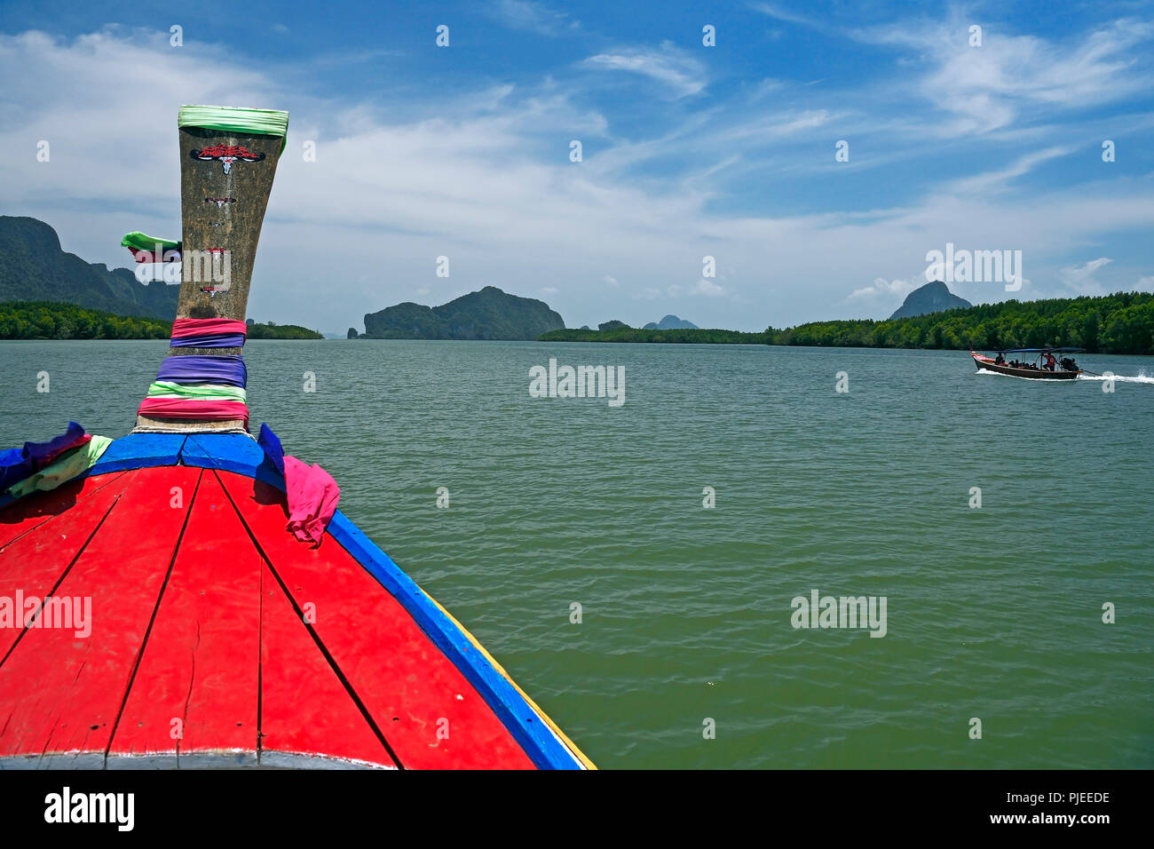 with the traditional Longtailboot on the way in the bay of Phang Nga