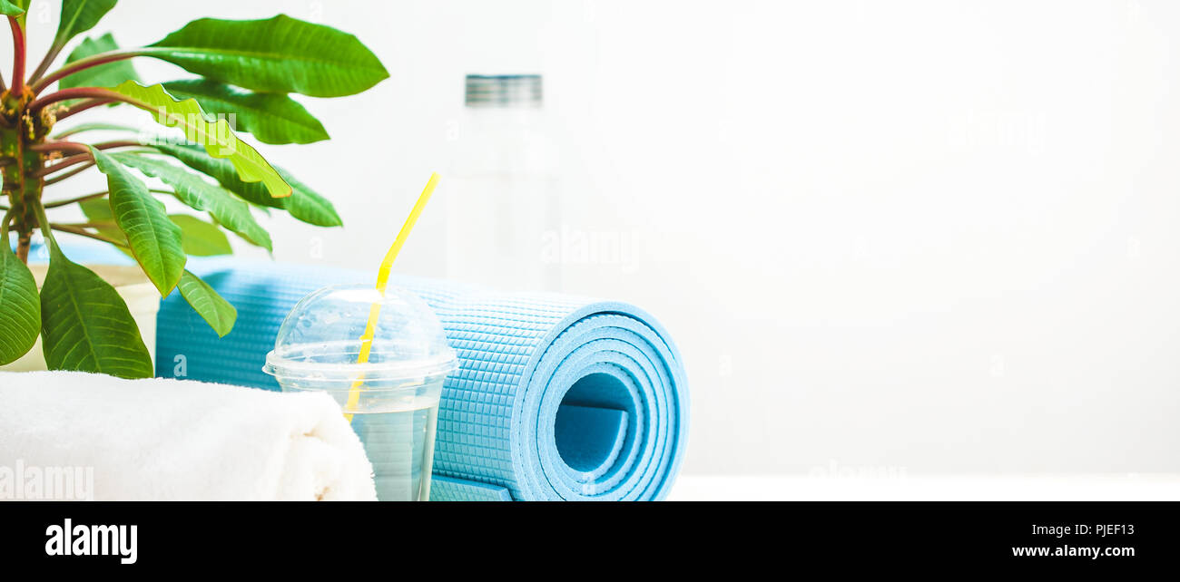 Set For Sports Yoga Mat Towel And A Bottle Of Water On A Light