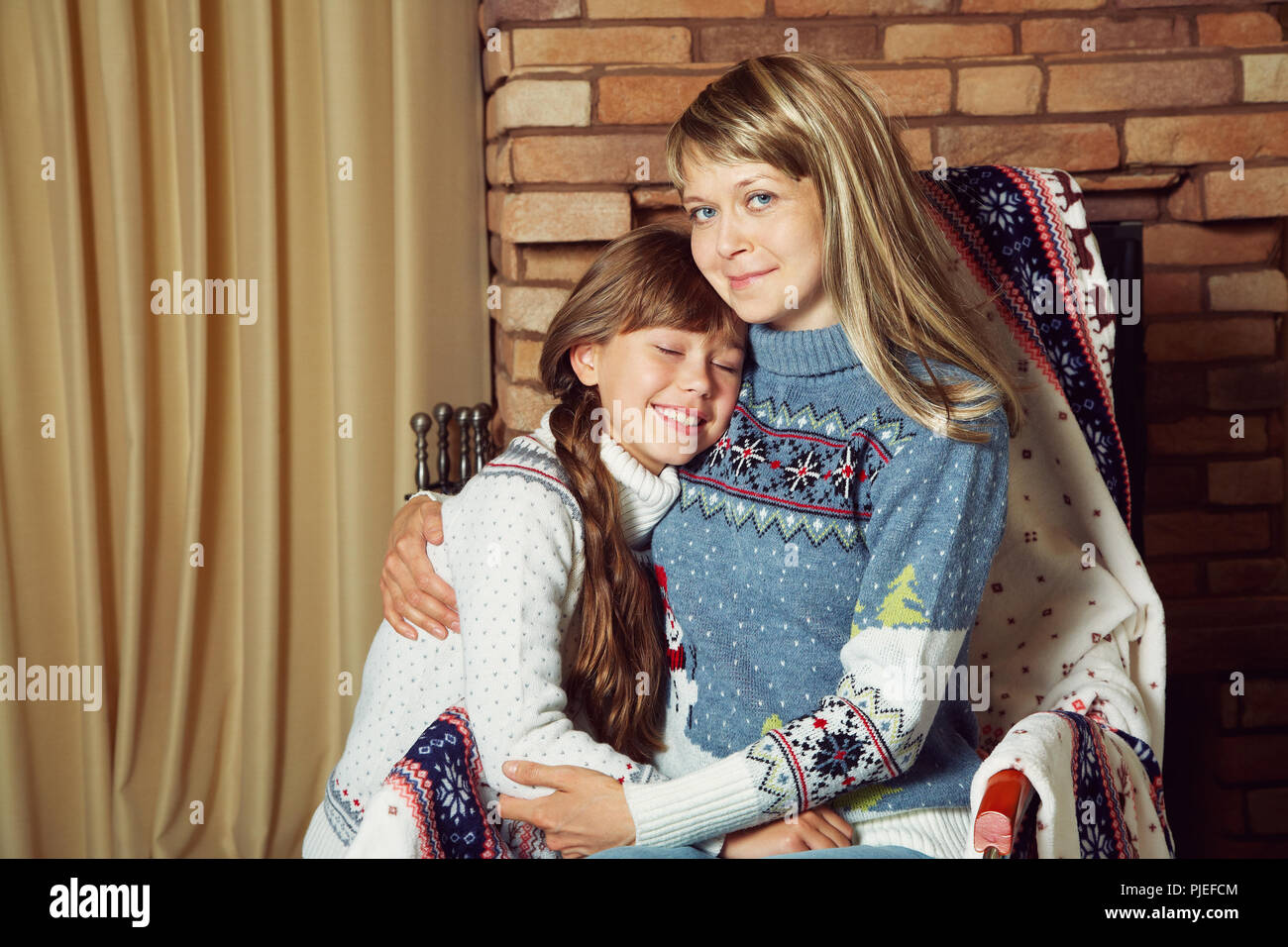 portrait of mother and daughter in sweaters Stock Photo