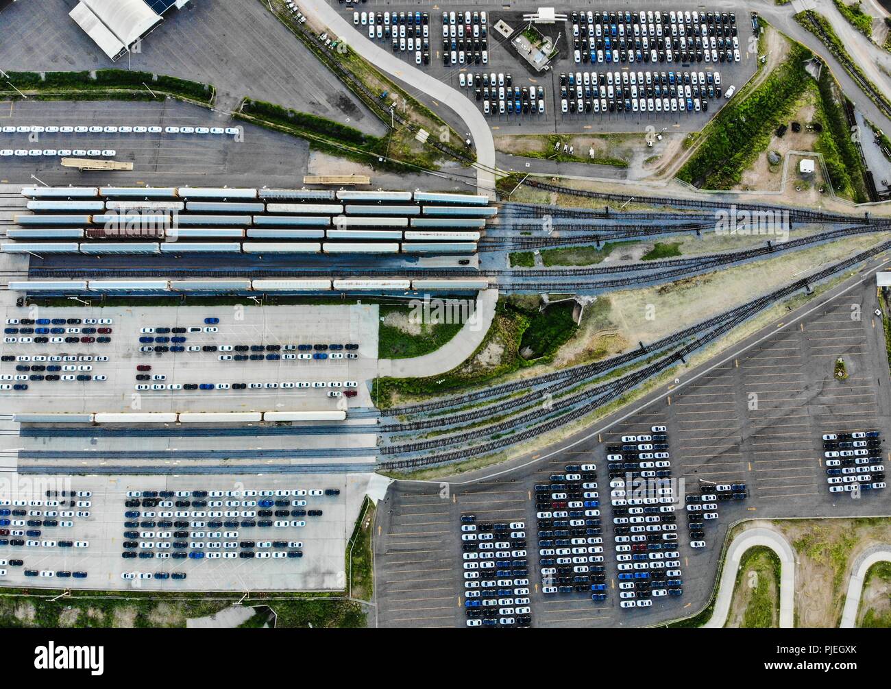 Aerial view of the Ford Motor Company automotive company in the Hermosillo industrial park, Sonora Mexico. Hundreds of new cars ready and arranged in order in the yard to be transported in train cars to the Automotive Industry market in the USA. Hermosillo Stamping and Assembly is an automobile assembly plant of the Ford brand. The plant currently assembles the Ford Fusion and Lincoln MKZ, Lincoln models for the North American market. Auto business Ford is an American multinational automaker. Photo: (NortePhoto / LuisGutierrez) ...  Vista aérea de empresa automotriz Ford Motor Company en el pa Stock Photo