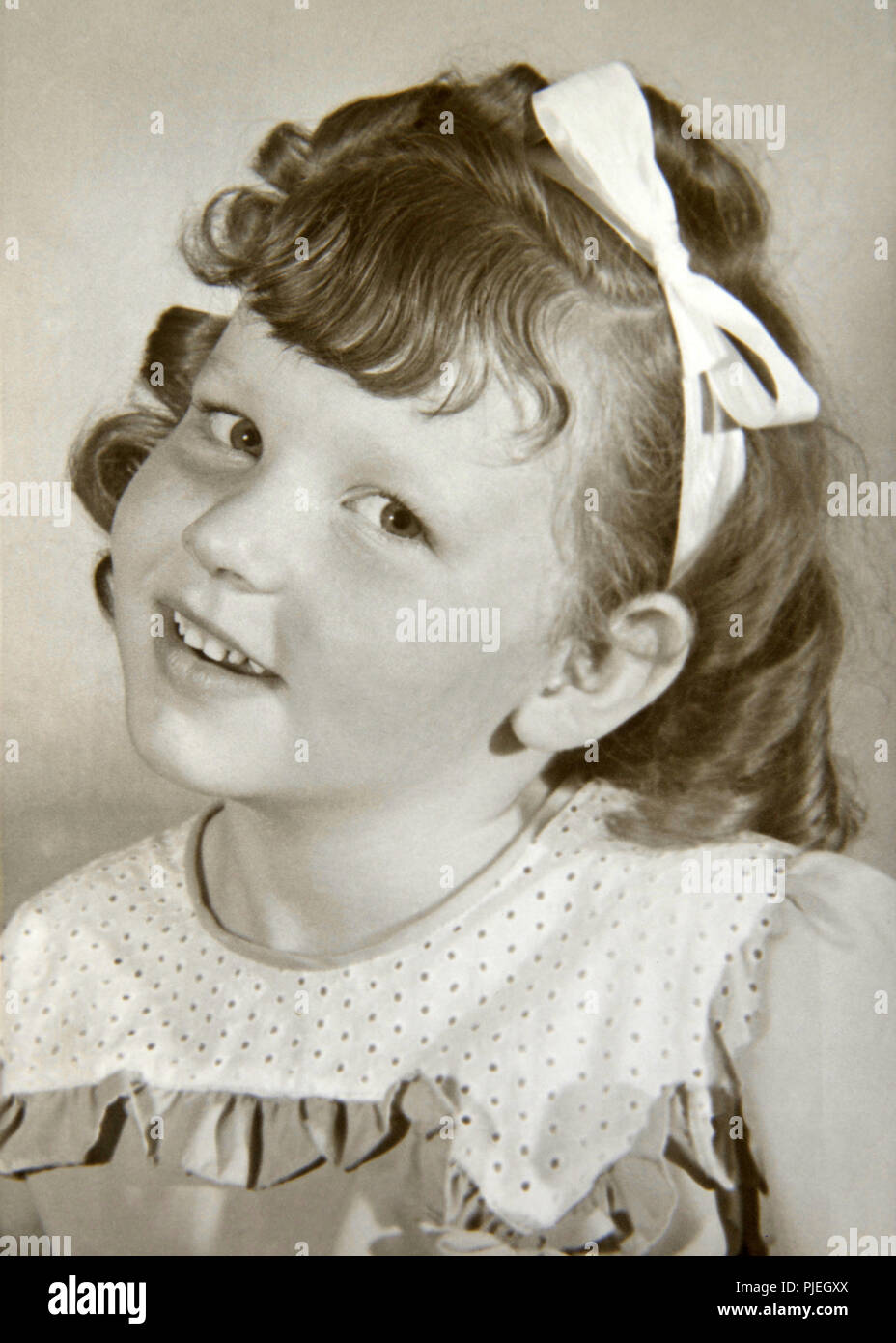 Vintage portrait of an adorable 4 to 5 year old caucasian girl wearing ...