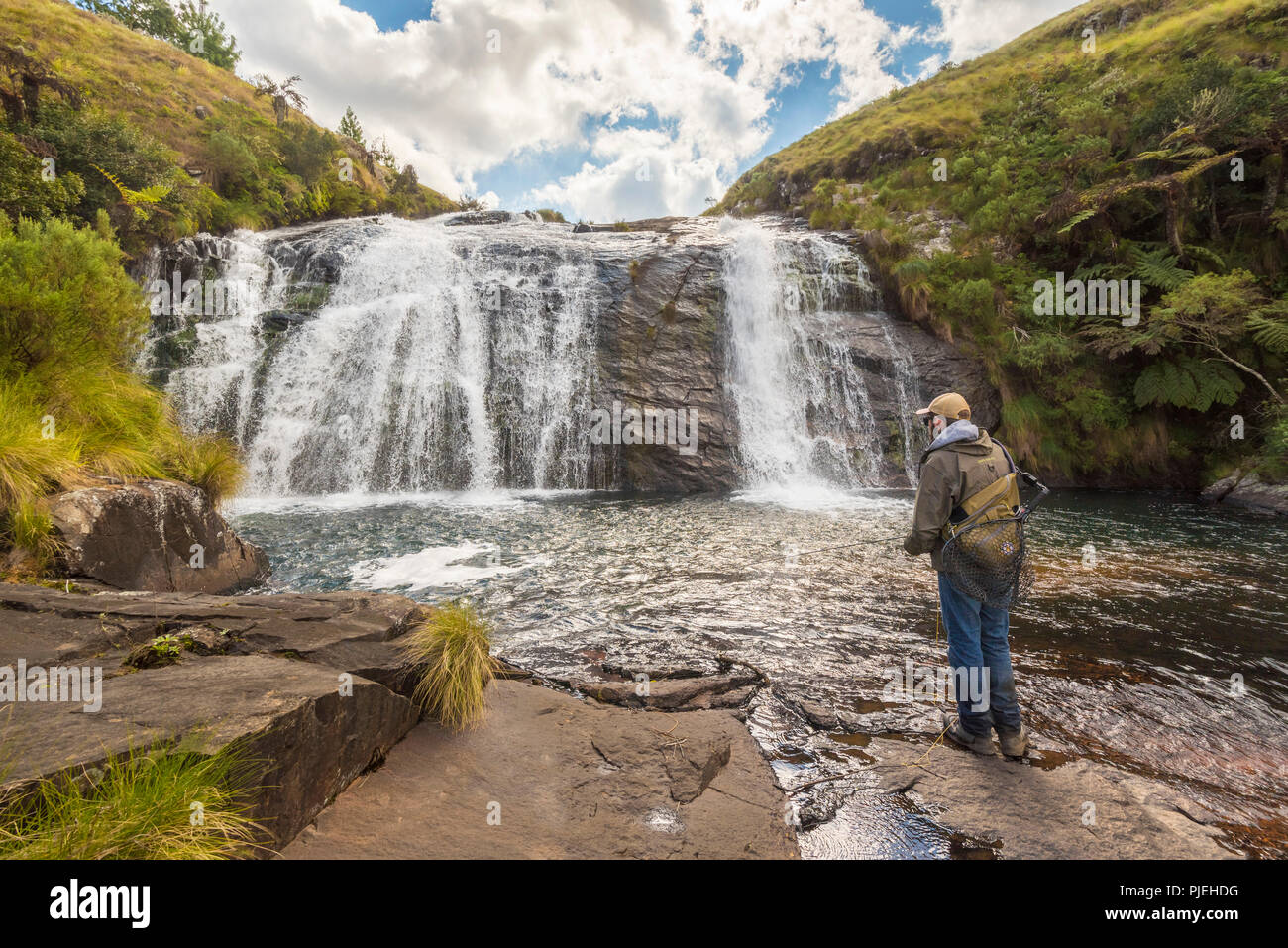 A flyfisherman fishes at Temburatedza waterfalls in Zimbabwe's Nyanga National Park. Stock Photo