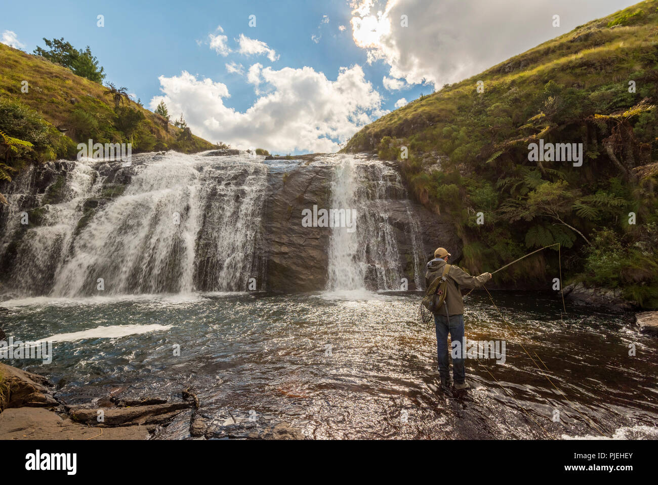 A flyfisherman fishes at Temburatedza waterfalls in Zimbabwe's Nyanga National Park. Stock Photo