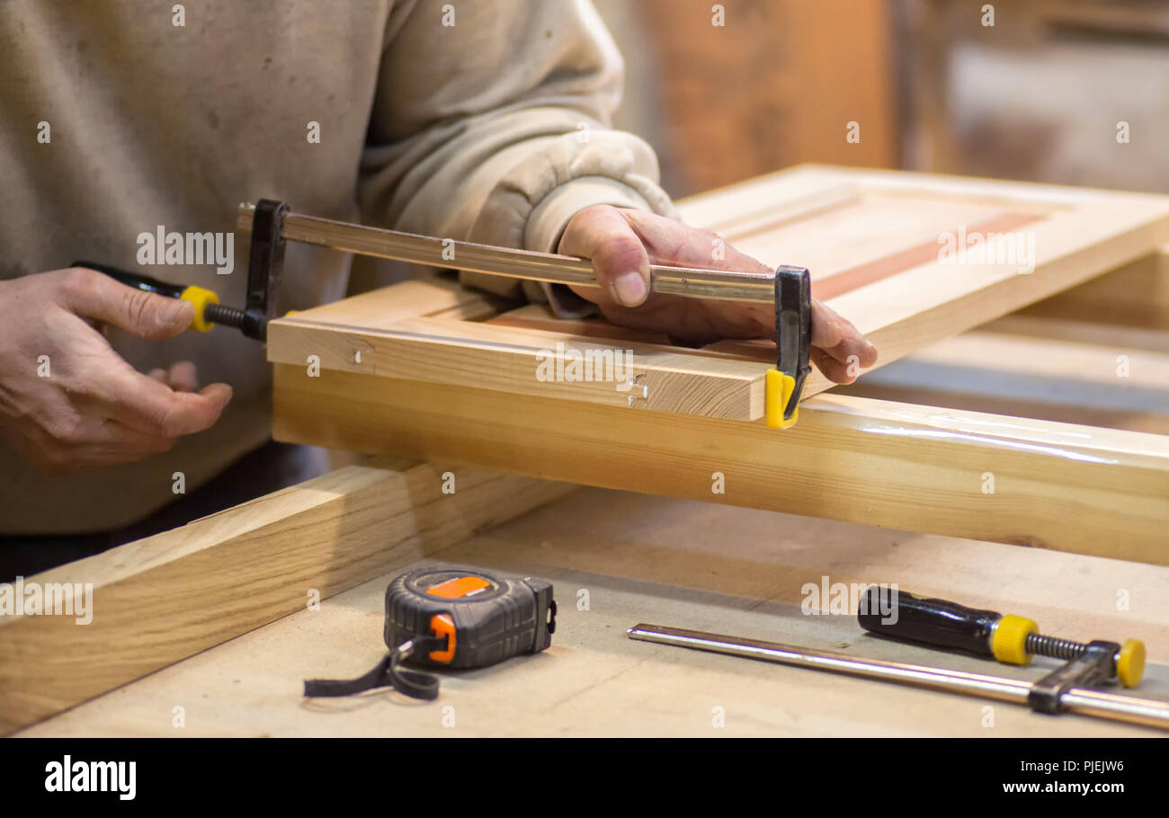 Manual manufacturing of furniture from a natural tree in a