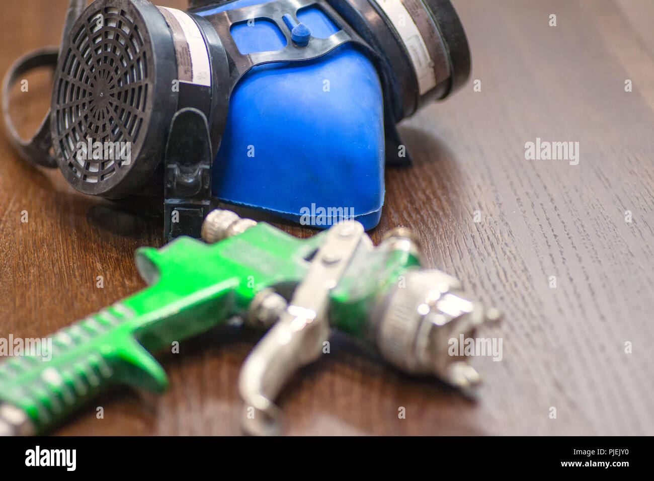 Tools for painting. Respirator, gloves, spray gun Stock Photo Alamy