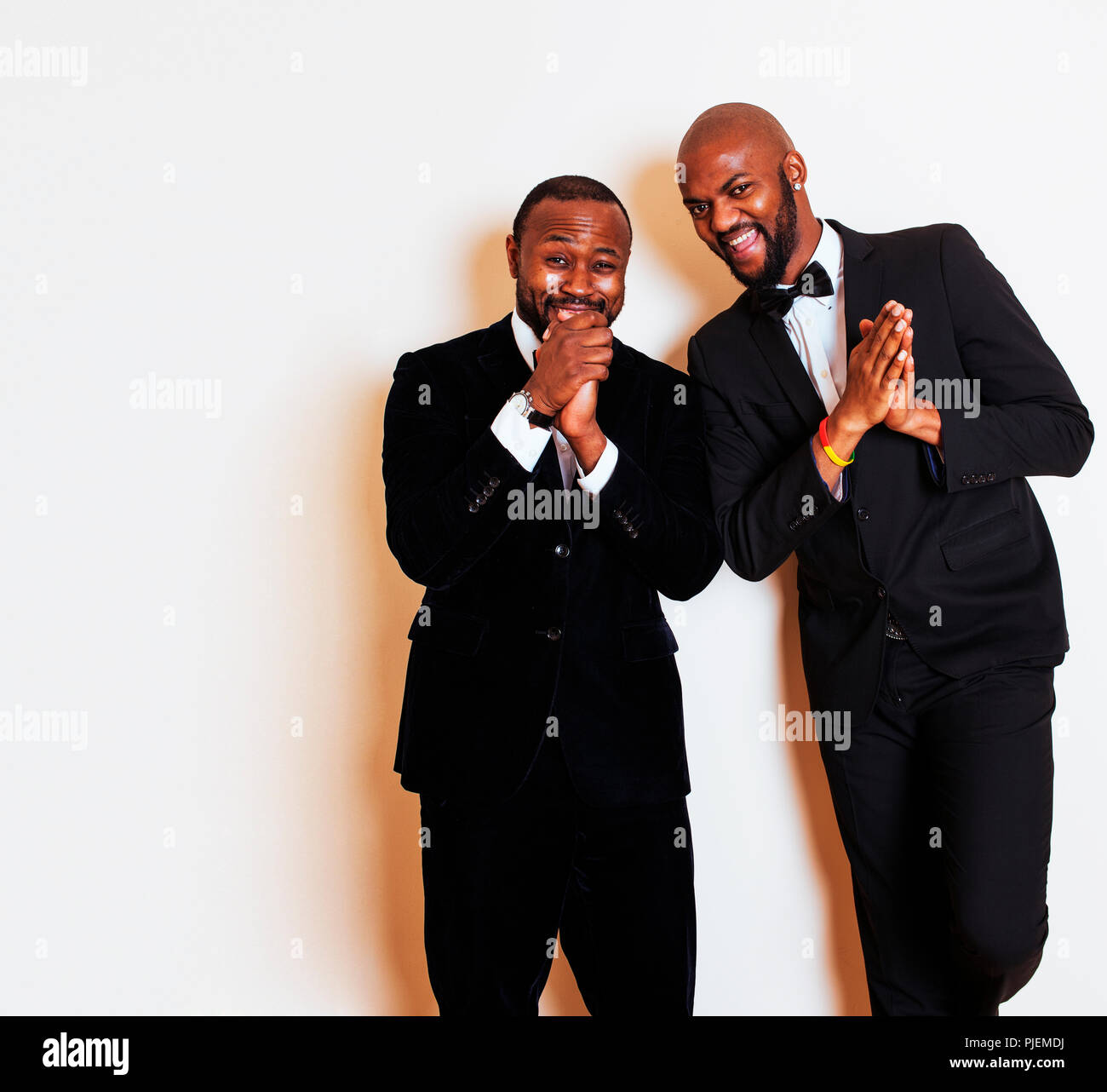two afro-american businessmen in black suits emotional posing, g Stock ...