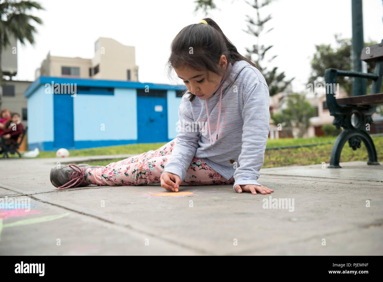 Kids Drawing with Chalk on Sidewalk Stock Photo - Alamy
