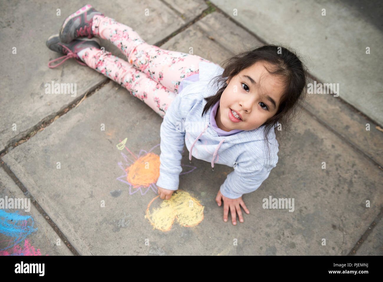 Kids Drawing with Chalk on Sidewalk Stock Photo - Alamy