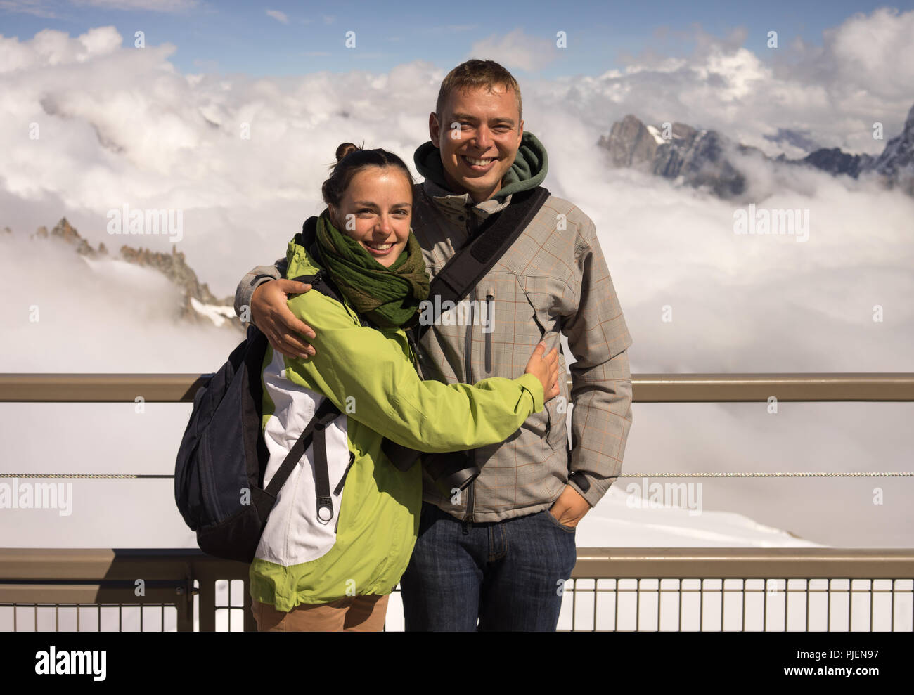 Young couple on vacation in the Alps with mountain background Stock Photo