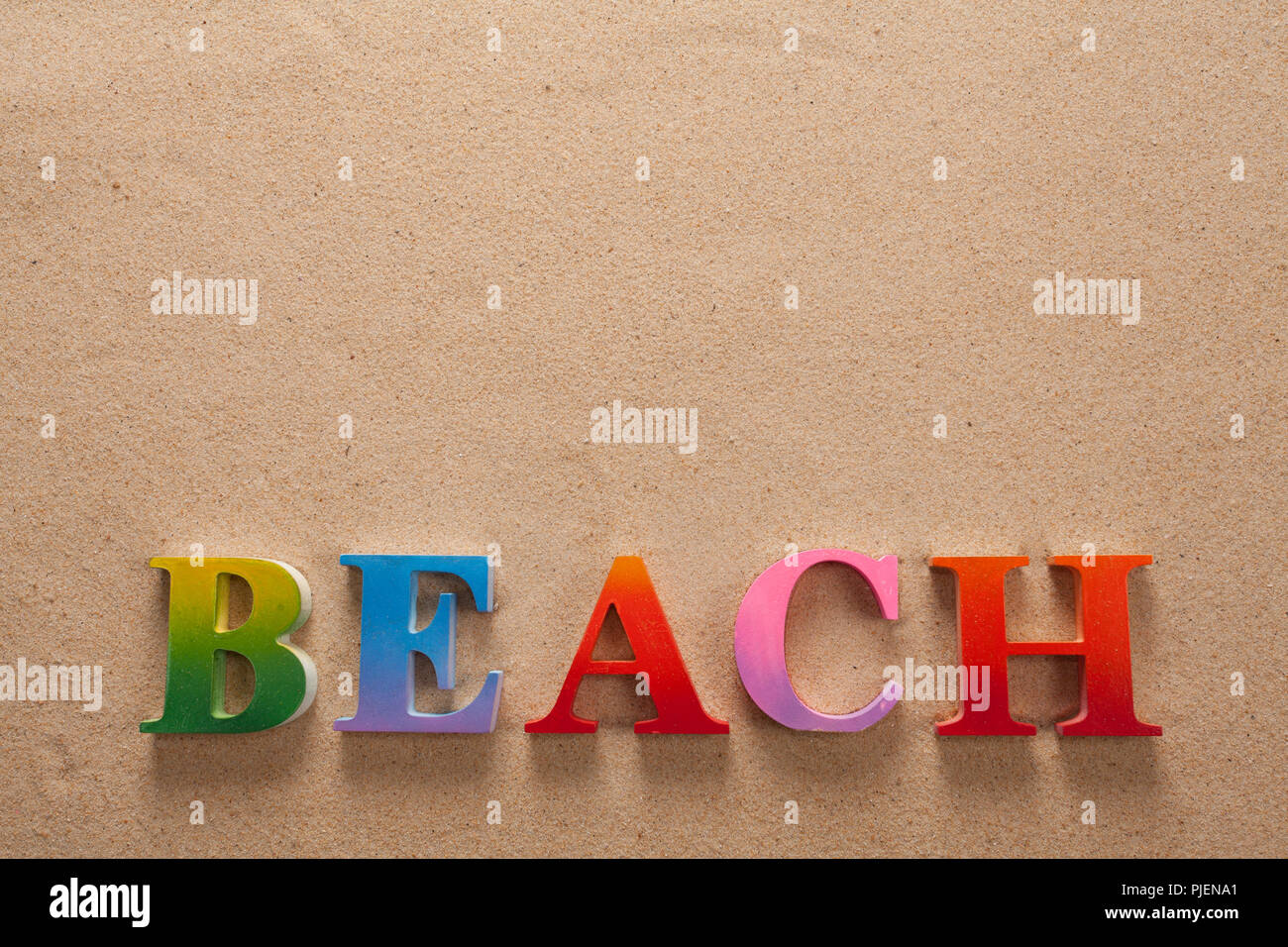 Top View Of Beach Written In Colorful Letters Decorate With