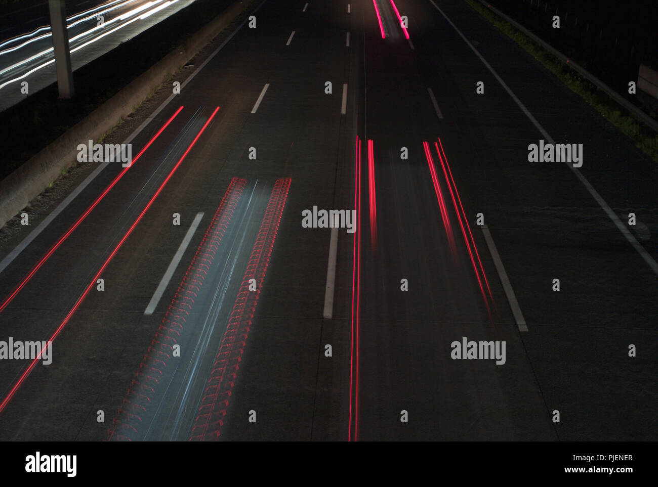 Traffic at night: Light Trails on a Motorway - long exposure - abstract background Stock Photo