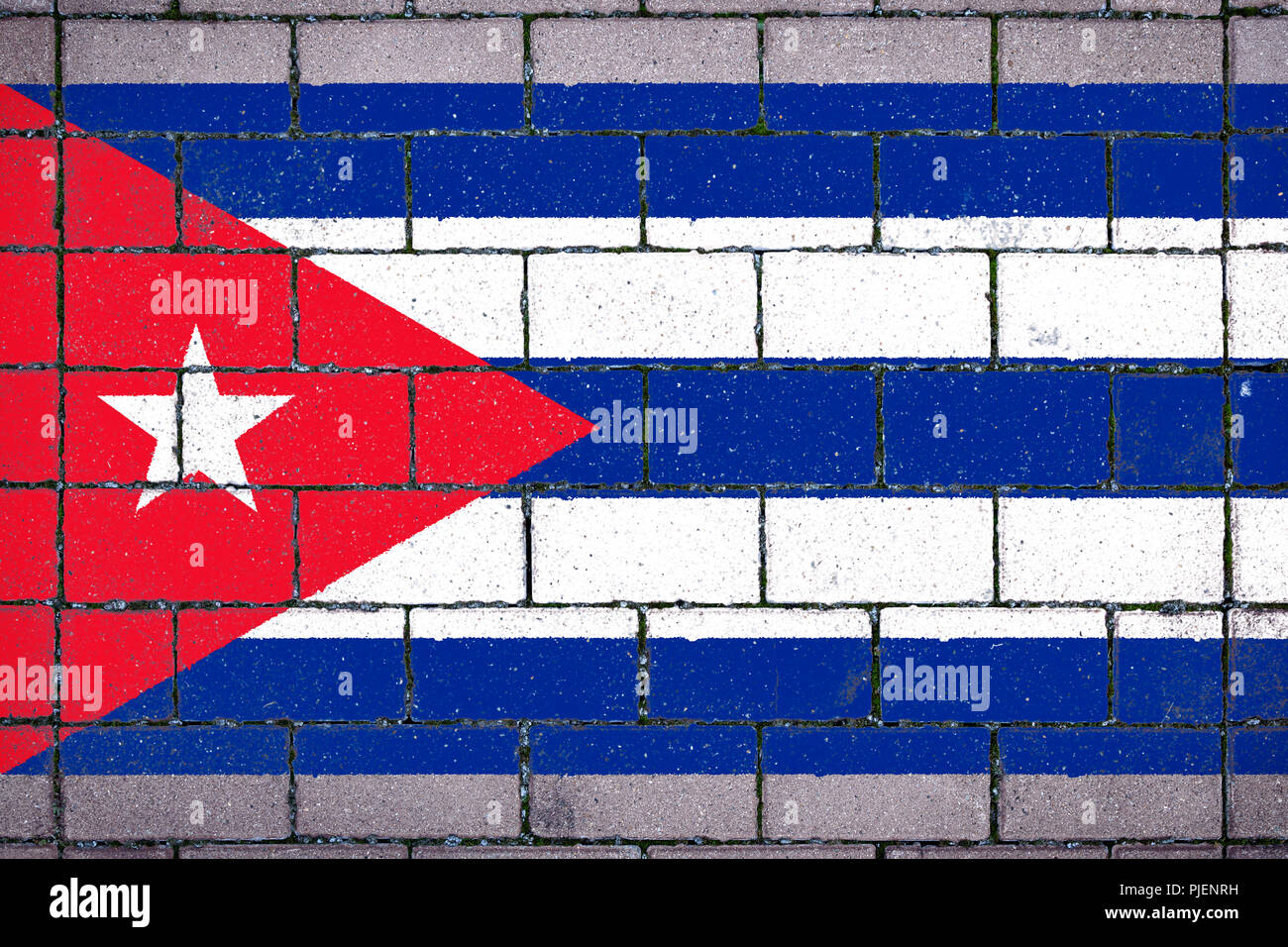 National flag of Cuba against a background of a stone background ...