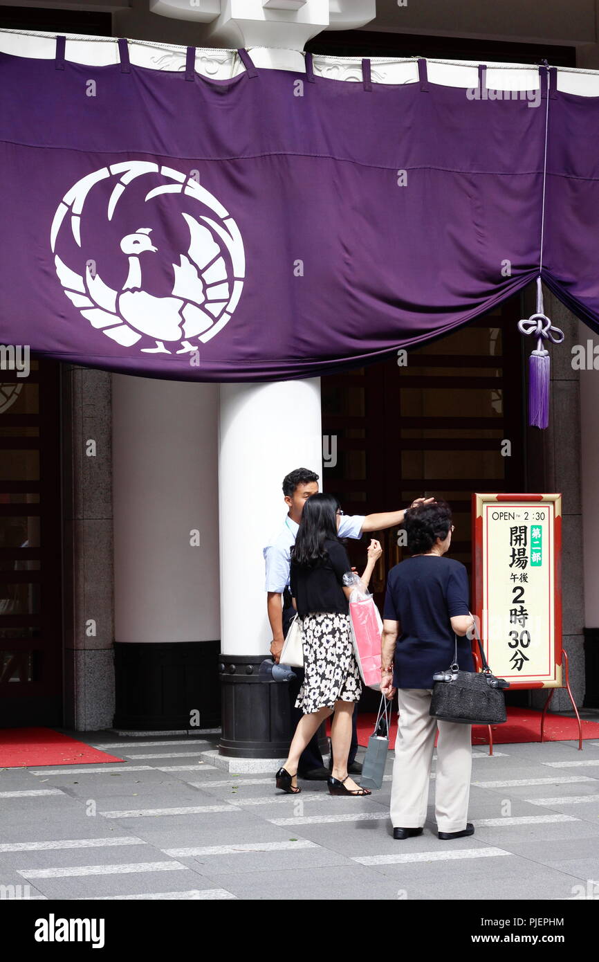 View of Ginza 's Kabuki-za kabuki theater where a worker is helping ...