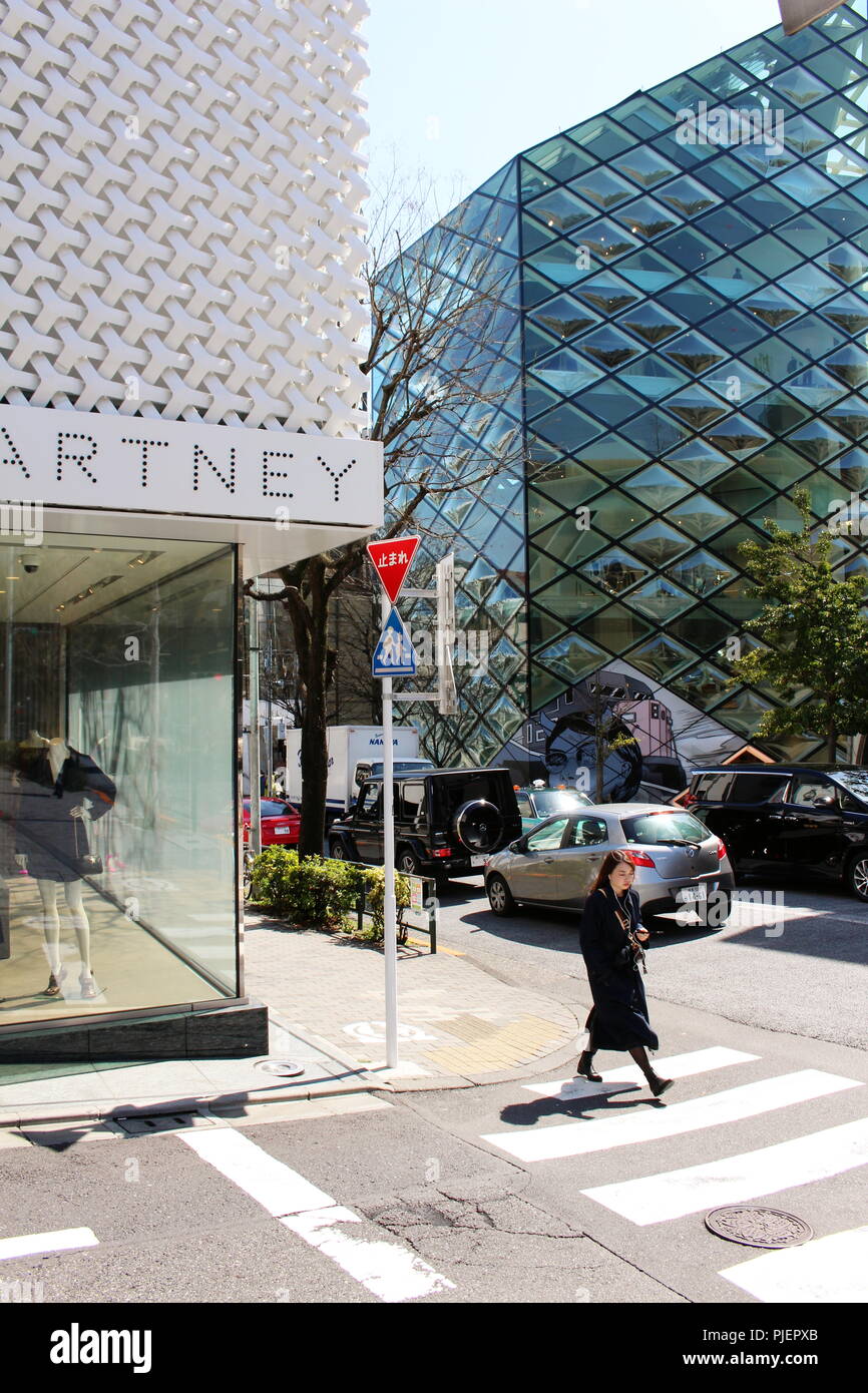 View of Aoyama's Stella McCartney with the futuristic green glass Herzog and de Meuron-designed Prada store across the street. Stock Photo