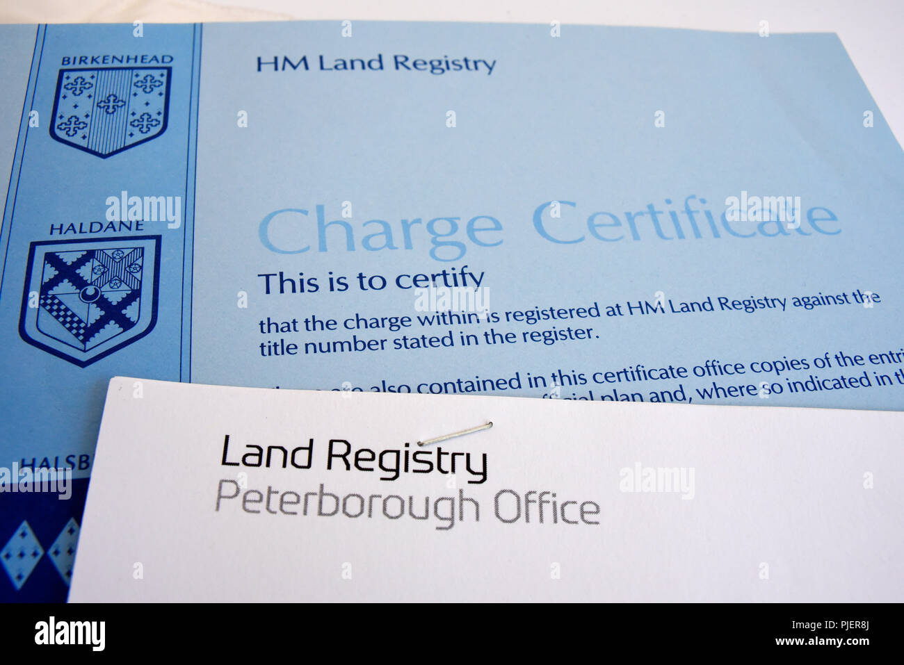 HM Land Registry document, paperwork. UK British charge certificate. Birkenhead, Haldane crest. Peterborough Office. Papers Stock Photo