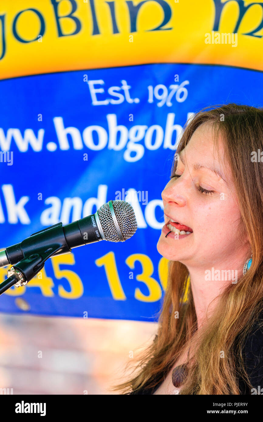 Close Up Of Face Of Caucasian Woman s Singing Into Microphone Folk Singer Beck Collins From The Duo Chris And Beck Collins Stock Photo Alamy