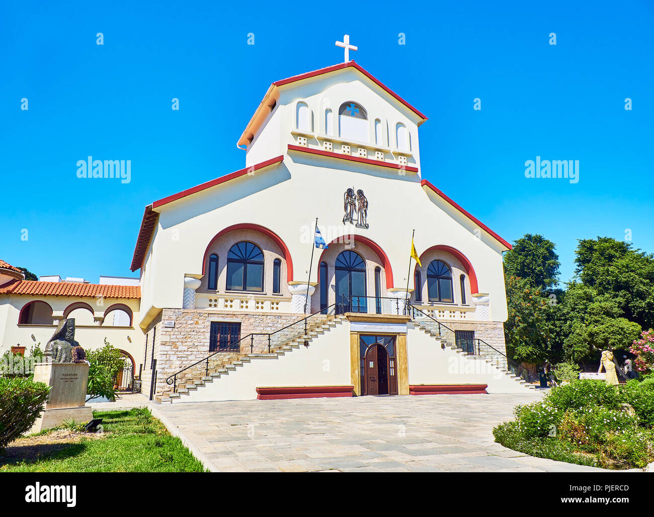 Kos, Greece - July 3, 2018. Principal facade of The Church of Evangelismos, Kos Town Cathedral. View from Vasileos Georgiou street. South Aegean. Stock Photo