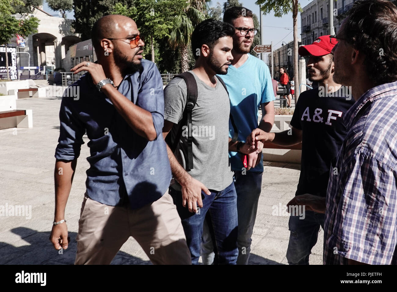 Jerusalem, Israel. 6th September, 2018. Arab men violently attempt to disrupt a press conference adjacent to City Hall at Safra Square announcing a new Palestinian party 'Al Quds Lana' (Jerusalem is Ours) for municipal elections scheduled for 30th October 2018, pelting participants with eggs as they oppose any type of cooperation with what they consider 'occupying Israeli forces'. li occupat Credit: Nir Alon/Alamy Live News Stock Photo