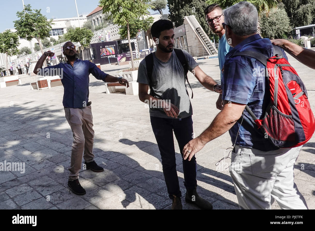 Jerusalem, Israel. 6th September, 2018. Arab men violently attempt to disrupt a press conference adjacent to City Hall at Safra Square announcing a new Palestinian party 'Al Quds Lana' (Jerusalem is Ours) for municipal elections scheduled for 30th October 2018, pelting participants with eggs as they oppose any type of cooperation with what they consider 'occupying Israeli forces'. li occupat Credit: Nir Alon/Alamy Live News Stock Photo