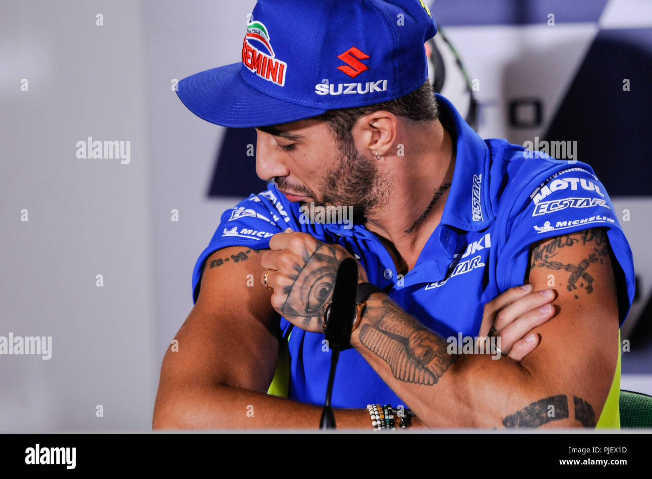 Misano, Misano World Circuit, Italy. 6th Sep, 2018. Italian Motorcycle Grand Prix, press conference; Andrea Iannone checks a tattoo Credit: Action Plus Sports/Alamy Live News Stock Photo